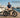 Premium Wildeway ORCA folding electric bike with hidden battery parked on a wooden pier at a luxury yacht marina