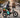 Wildeway SummitX 60Ah dual-motor electric bike climbing a steep city hill, featuring a large thermal delivery box secured to the rear rack and backrest.