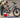 A person safely washing a Wildeway off-road electric bike with a sponge and soapy water after removing the battery.