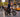Food delivery rider checking app on a Wildeway SummitX fat-tire e-bike with an insulated delivery bag and 160-mile range battery in a busy city.