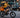 A delivery rider on a black WILDEWAY FW11 step-thru folding e-bike with a large thermal bag attached to the sturdy rear rack on a busy city street.