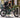 Commuter securing an electric bike frame and wheels to a fixed bicycle rack with two locks