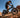 Wildeway ORCA dual motor electric fat tire bike powering up a steep off-road dirt trail, showcasing its 2300W peak performance