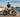 Premium Wildeway ORCA folding electric bike with hidden battery parked on a wooden pier at a luxury yacht marina