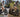 Split comparison banner illustrating 750W Class 2 street-legal mode on public roads versus 2000W AWD dual-motor mode on off-road mountain trails.