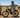Rancher riding a Soared high-step dual-motor e-bike while inspecting a fence line on a sunny Montana ranch.
